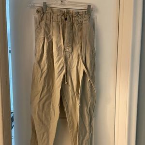 Free People paper bag pants. Small stain on leg. Price is reflected.